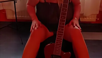 Amateur Blonde Plays Guitar While Fondling Her Large Breasts In Lingerie